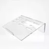 Support PC portable ergonomique en plexiglass transparent avec fentes de ventilation, fabriqué en Tunisie.