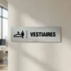 Plaque Vestiaires Femme – Signalétique Aluminium Brossé Signalétique vestiaires femme icône cintre sur fond alu brossé.
